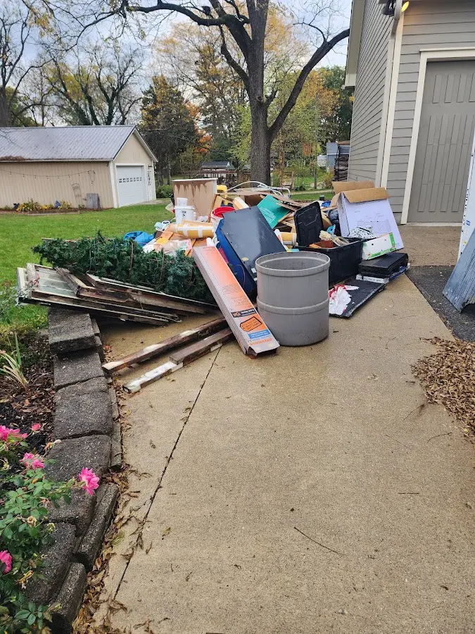 Dumpster being loaded with debris for 3 Yard Dumpster Rental in Chardon